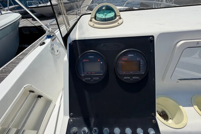 Slide: The Image of 2003 Hydra-Sports 180 CC boat dashboard with Yamaha speed and tachometer gauges. - 12