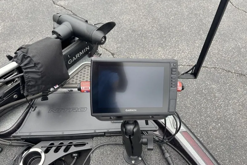 Slide: The Image of 2021 Nitro Z21 boat with Garmin display and trolling motor on deck. - 23