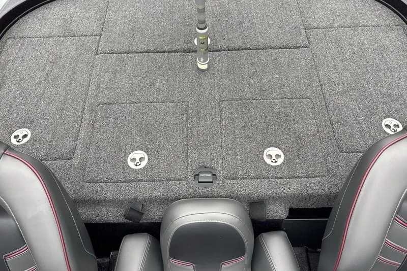 Slide: The Image of 2021 Nitro Z21 boat deck with gray carpet and storage compartments. - 38