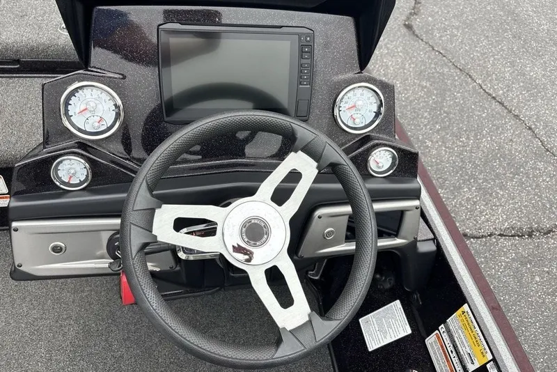Slide: The Image of Steering console of a 2021 Nitro Z21 boat with gauges and display. - 14