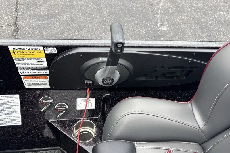 Slide: The Image of 2021 Nitro Z21 boat control panel with throttle lever and seating. - 17