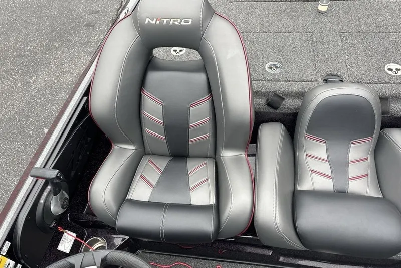 Slide: The Image of 2021 Nitro Z21 boat seats with sleek gray and red design. - 24