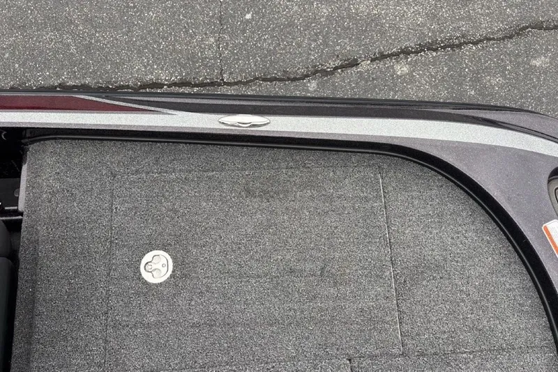 Slide: The Image of 2021 Nitro Z21 boat deck with textured surface and metal latch. - 34