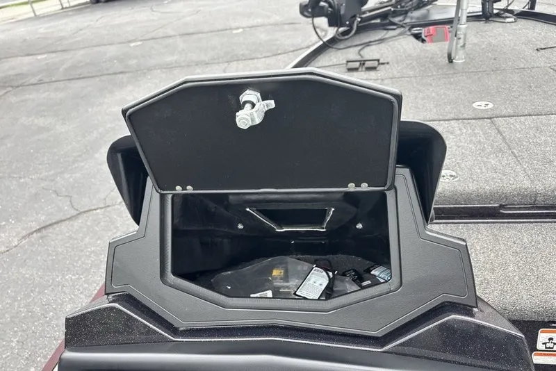 Slide: The Image of Open storage compartment on a 2021 Nitro Z21 boat, showing interior contents. - 37