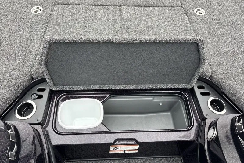 Slide: The Image of 2021 Nitro Z21 boat storage compartment with open lid and cup holders. - 20