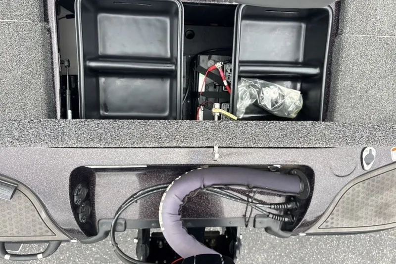Slide: The Image of 2021 Nitro Z21 boat interior showing storage compartments and wiring. - 31