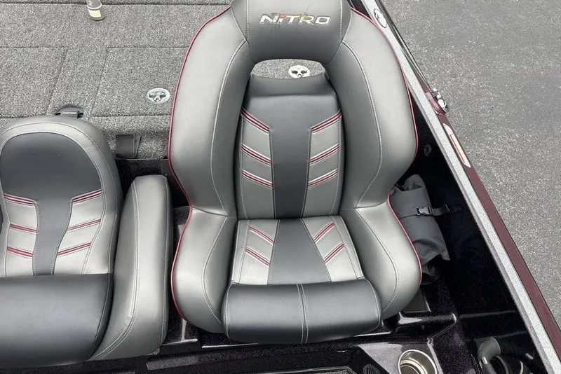 Slide: The Image of 2021 Nitro Z21 boat seat with gray and black upholstery, red stitching accents. - 26
