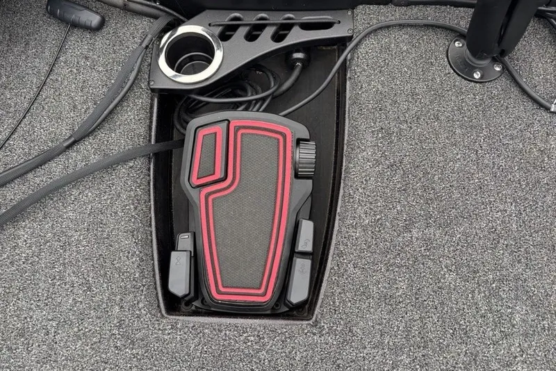 Slide: The Image of Foot pedal control on a 2021 Nitro Z21 boat, featuring a textured surface and cup holder. - 15