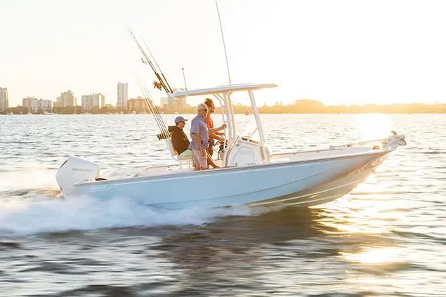 Slide: The Image of Manufacturer Provided Image: 2023 Boston Whaler 210 Montauk boat cruising on water at sunset. - 13