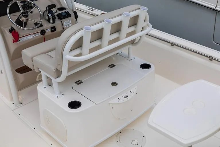 Slide: The Image of Manufacturer Provided Image: 2023 Boston Whaler 210 Montauk boat interior with helm seat and storage. - 21