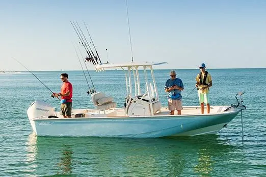 Slide: The Image of Manufacturer Provided Image: 2023 Boston Whaler 210 Montauk boat with three people fishing on calm water. - 15