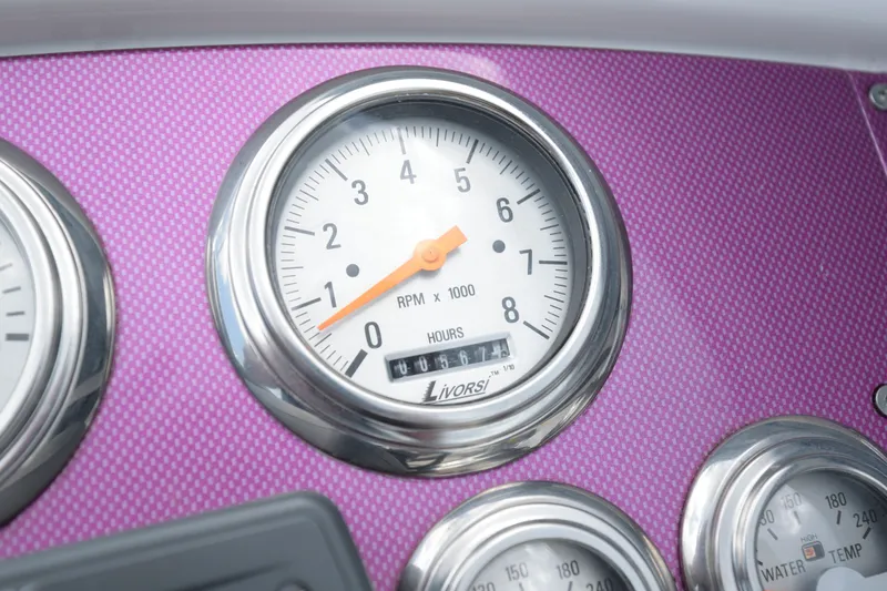 Slide: The Image of Close-up of 2006 Formula 353 FASTech tachometer on a purple dashboard. - 13
