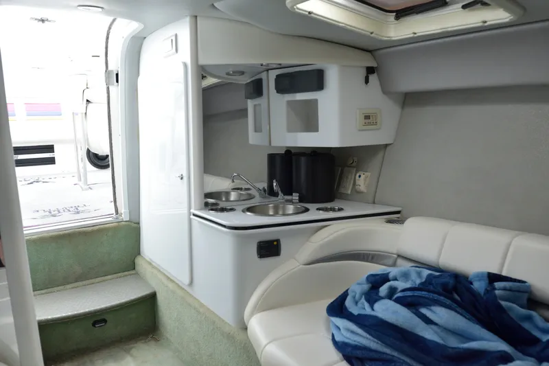 Slide: The Image of Interior of 2006 Formula 353 FASTech boat with kitchenette and seating area. - 19
