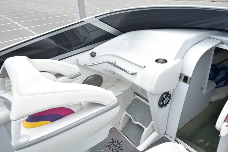 Slide: The Image of 2006 Formula 353 FASTech boat interior with white seating and modern dashboard design. - 17