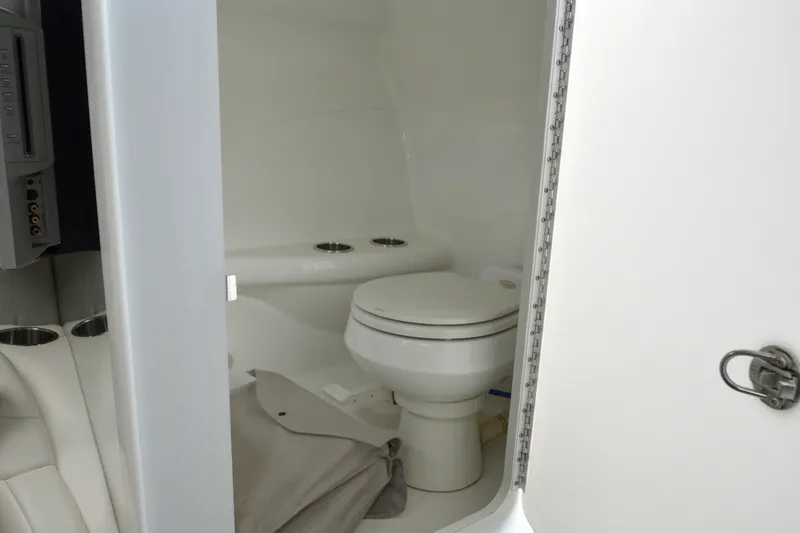 Slide: The Image of Interior of 2006 Formula 353 FASTech boat showing compact bathroom with toilet. - 21