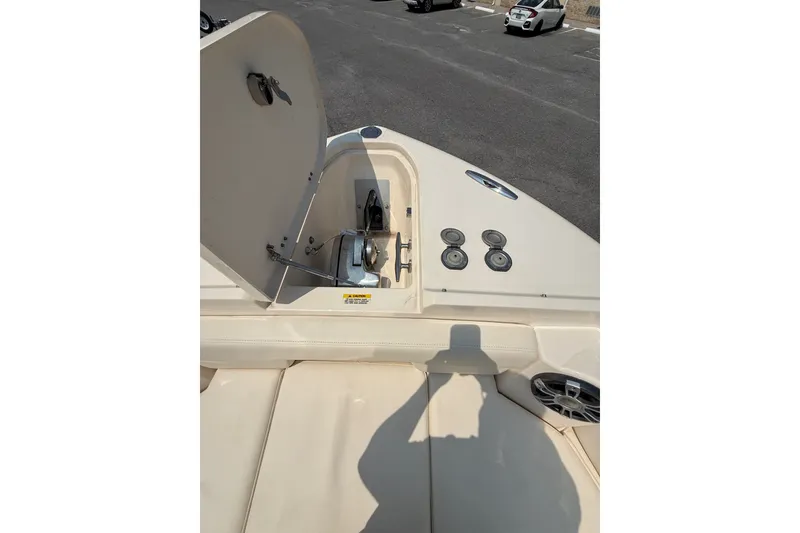 Slide: The Image of 2024 Grady-White Freedom 285 boat deck with open storage compartment and speaker system. - 19