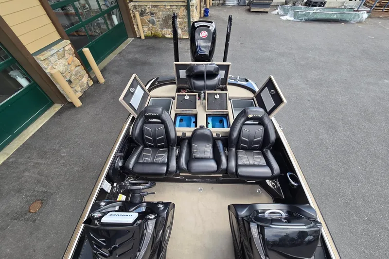 Slide: The Image of 2016 Nitro Z21 boat interior with black leather seats and storage compartments. - 1
