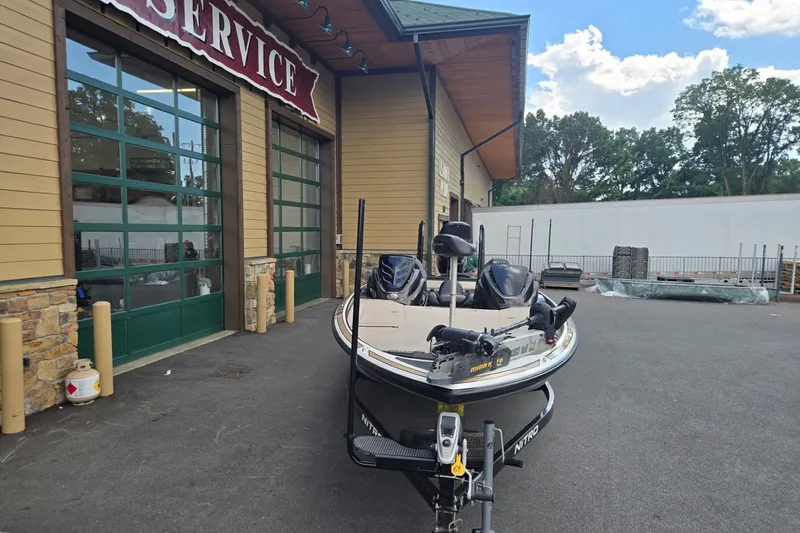 Slide: The Image of 2016 Nitro Z21 boat parked outside a service center on a sunny day. - 8