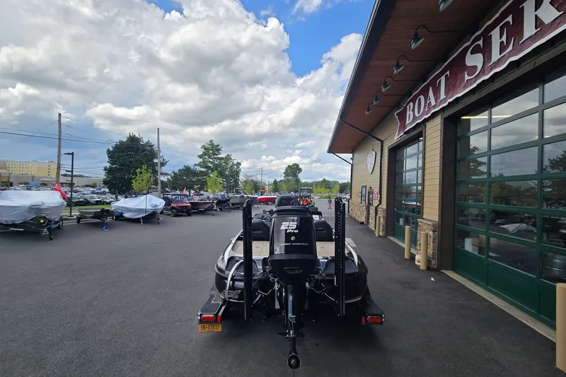 Slide: The Image of 2016 Nitro Z21 boat outside service center under cloudy sky. - 5