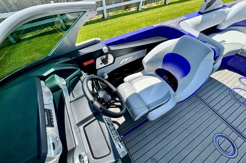 Slide: The Image of 2018 MB F24 Tomcat boat interior with sleek dashboard and comfortable seating. - 10