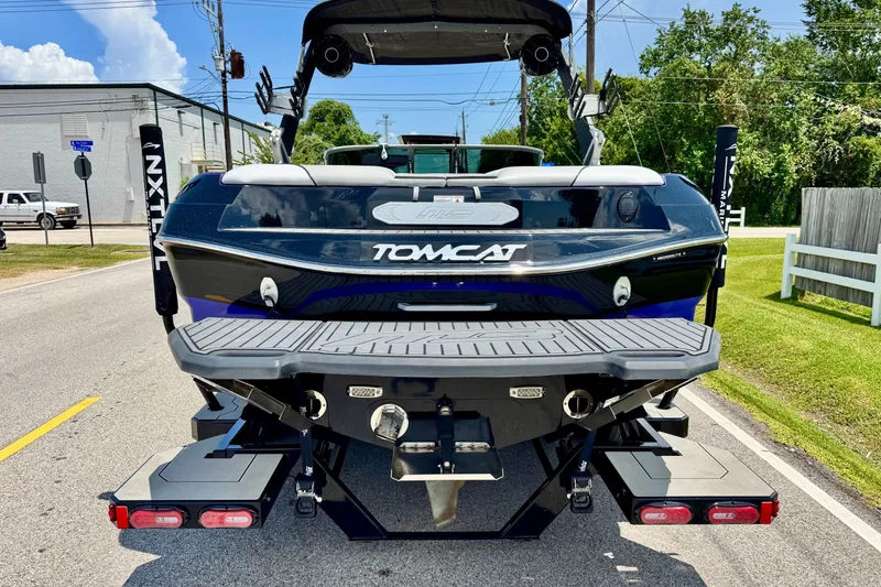 Slide: The Image of 2018 MB F24 Tomcat boat rear view on street, showcasing sleek design and features. - 3