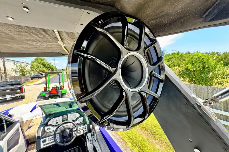 Slide: The Image of Large speaker on 2018 MB F24 Tomcat boat, showcasing dashboard and outdoor setting. - 17
