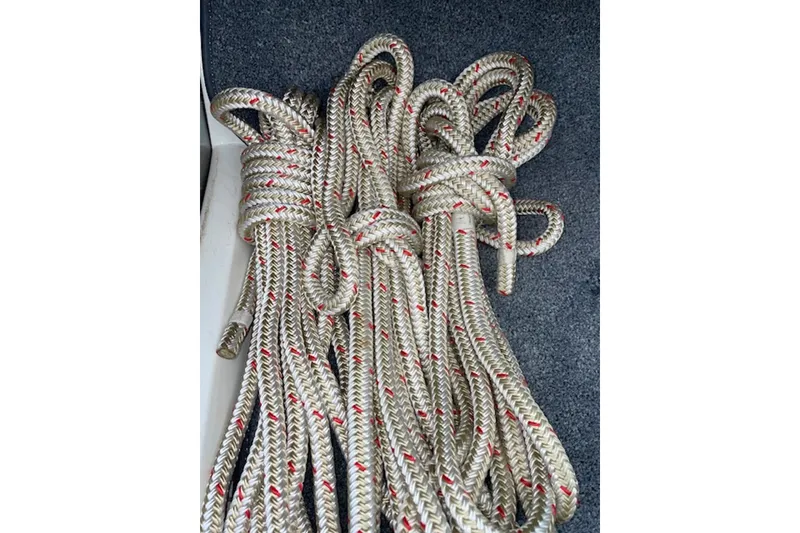 Slide: The Image of Coiled ropes on a 1990 Donzi Sweet 16 boat deck. - 27