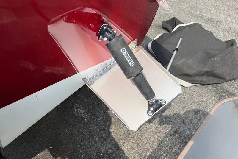 Slide: The Image of 1990 Donzi Sweet 16 boat with trim tab and red hull detail. - 19