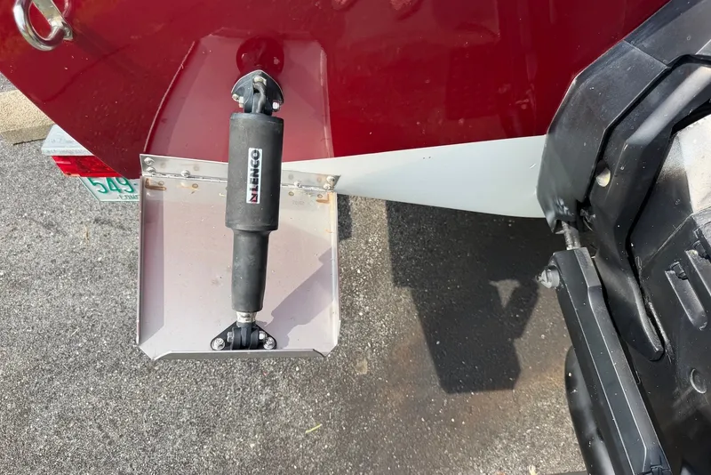 Slide: The Image of 1990 Donzi Sweet 16 boat with Lenco trim tab on asphalt surface. - 18