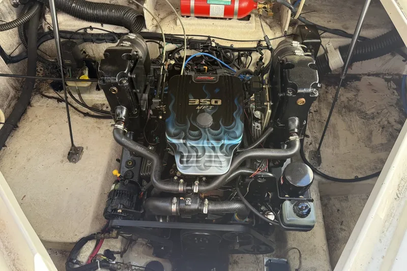 Slide: The Image of Engine compartment of a 2009 Sea Ray 230 Sundancer with a 350 MPI engine. - 13