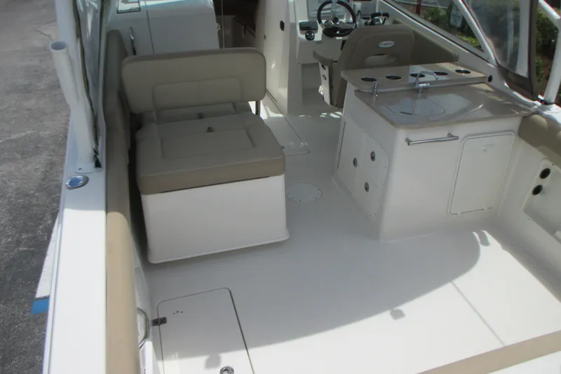 Slide: The Image of 2017 Sailfish 275 DC boat interior with seating and helm station. - 14
