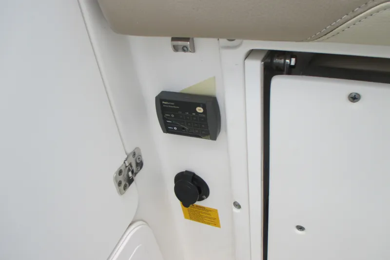 Slide: The Image of Control panel and outlet on 2017 Sailfish 275 DC boat interior. - 12