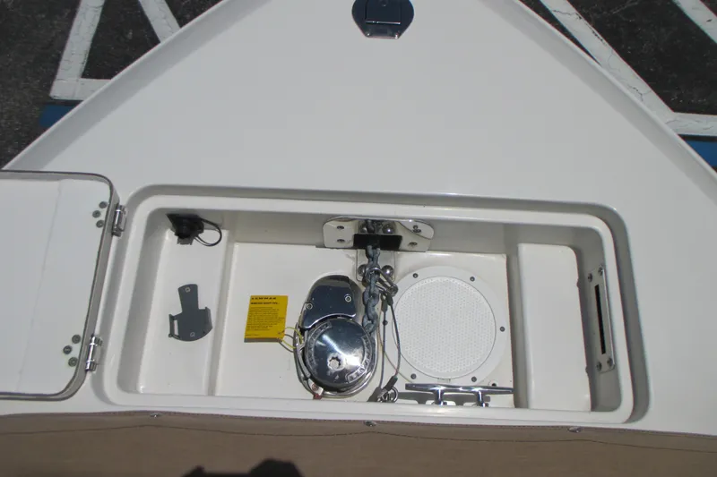 Slide: The Image of 2017 Sailfish 275 DC boat anchor compartment with chain and winch system. - 35