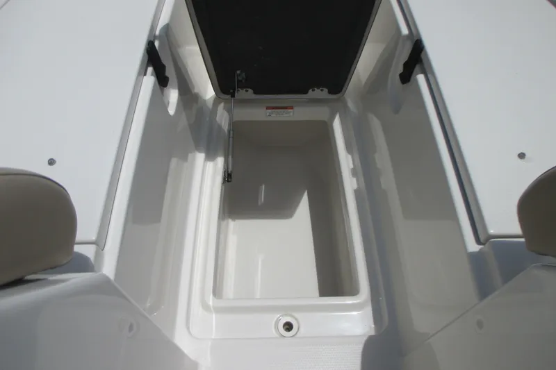 Slide: The Image of Open storage compartment on a 2017 Sailfish 275 DC boat, showcasing interior space. - 34