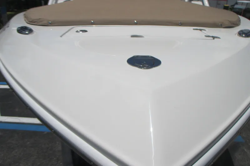 Slide: The Image of Bow view of 2017 Sailfish 275 DC boat with beige cover. - 7