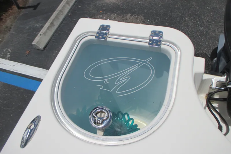 Slide: The Image of Livewell on a 2017 Sailfish 275 DC boat with logo design. - 13