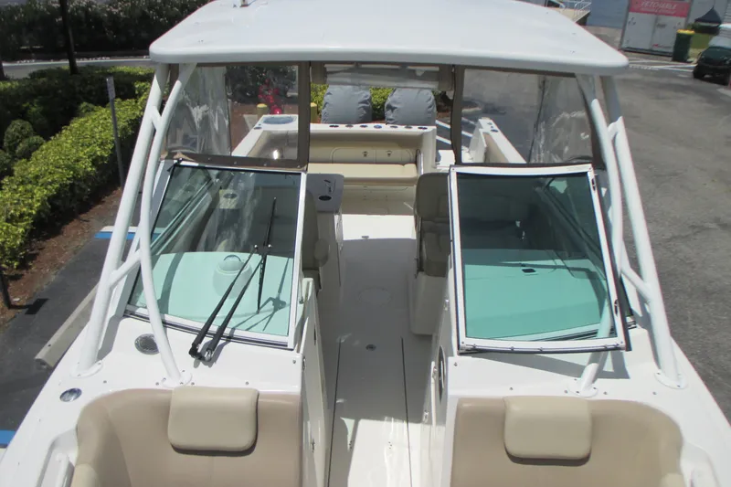 Slide: The Image of 2017 Sailfish 275 DC boat interior with dual consoles and seating. - 31