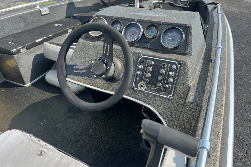 Slide: The Image of 1988 Charger 162V boat dashboard with steering wheel and instrument panel. - 5