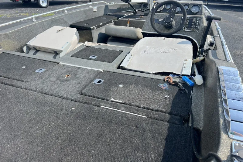 Slide: The Image of 1988 Charger 162V boat interior with steering wheel and storage compartments. - 7