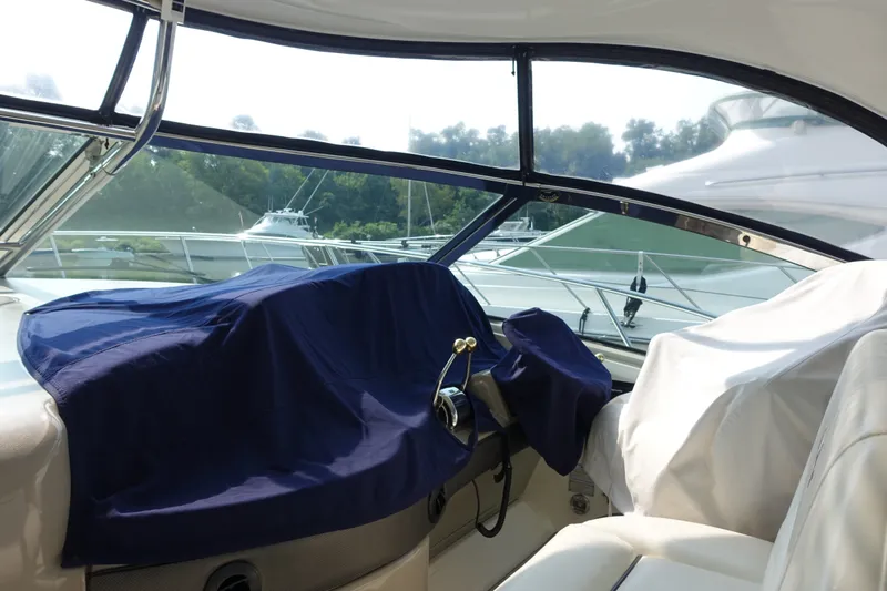 Slide: The Image of Interior view of a 2006 Sea Ray 44 Sundancer yacht with covered controls. - 52