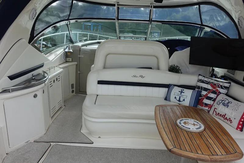 Slide: The Image of Interior of a 2006 Sea Ray 44 Sundancer yacht with seating and nautical decor. - 17
