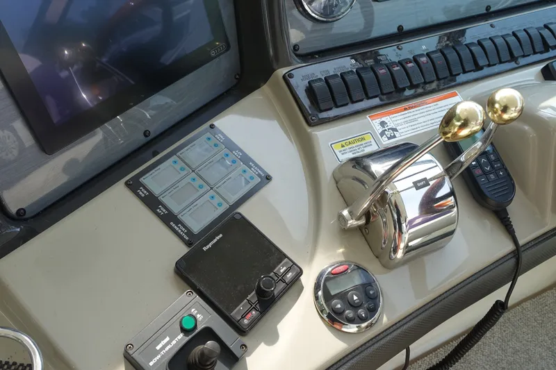 Slide: The Image of Control panel of a 2006 Sea Ray 44 Sundancer yacht with navigation equipment. - 9