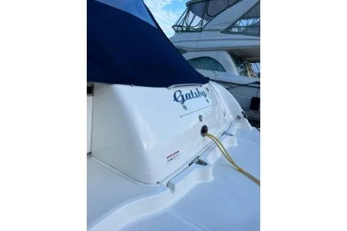 Slide: The Image of 2006 Sea Ray 44 Sundancer yacht docked, featuring sleek design and elegant detailing. - 3