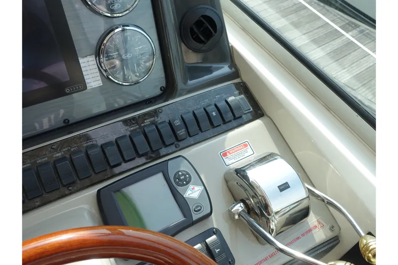 Slide: The Image of Control panel of a 2006 Sea Ray 44 Sundancer yacht with gauges and switches. - 10