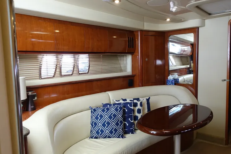 Slide: The Image of Luxurious interior of 2006 Sea Ray 44 Sundancer yacht with elegant seating and wooden finishes. - 33