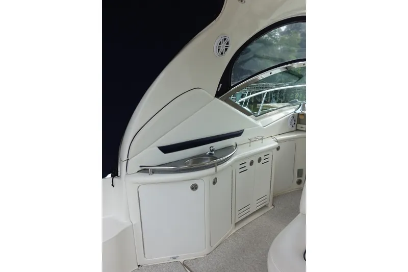 Slide: The Image of Interior view of 2006 Sea Ray 44 Sundancer yacht with sink and storage cabinets. - 12