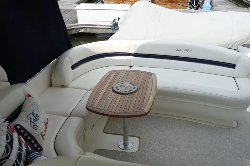 Slide: The Image of Luxurious seating area on a 2006 Sea Ray 44 Sundancer yacht with elegant wood table. - 20