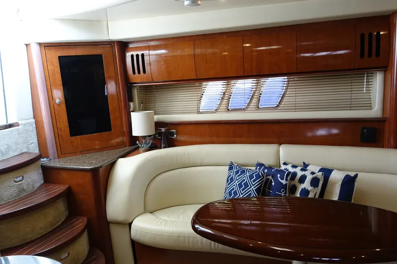 Slide: The Image of Luxurious interior of 2006 Sea Ray 44 Sundancer yacht with elegant wood finishes and plush seating. - 32
