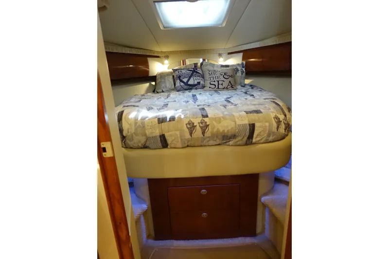 Slide: The Image of Luxurious cabin interior of 2006 Sea Ray 44 Sundancer yacht with cozy bedding. - 40