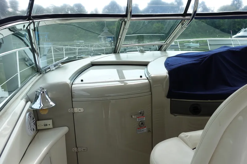 Slide: The Image of Interior view of 2006 Sea Ray 44 Sundancer yacht cockpit with helm and seating. - 15